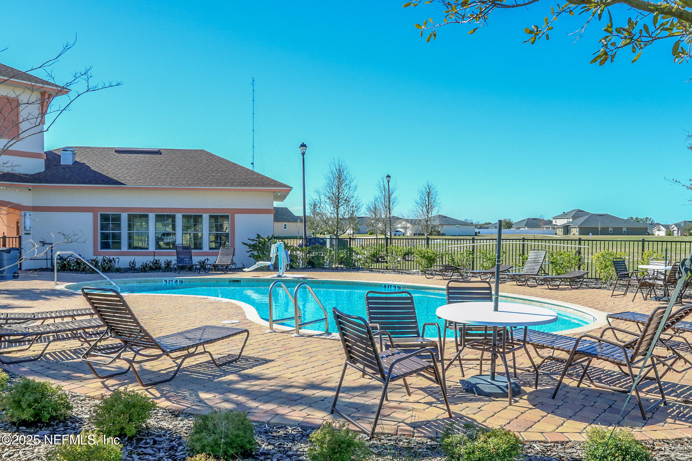 4100 Spring Creek Lane Middleburg, FL 32068 - Photo 51 of 58 a view of a patio with table and chairs with wooden floor
