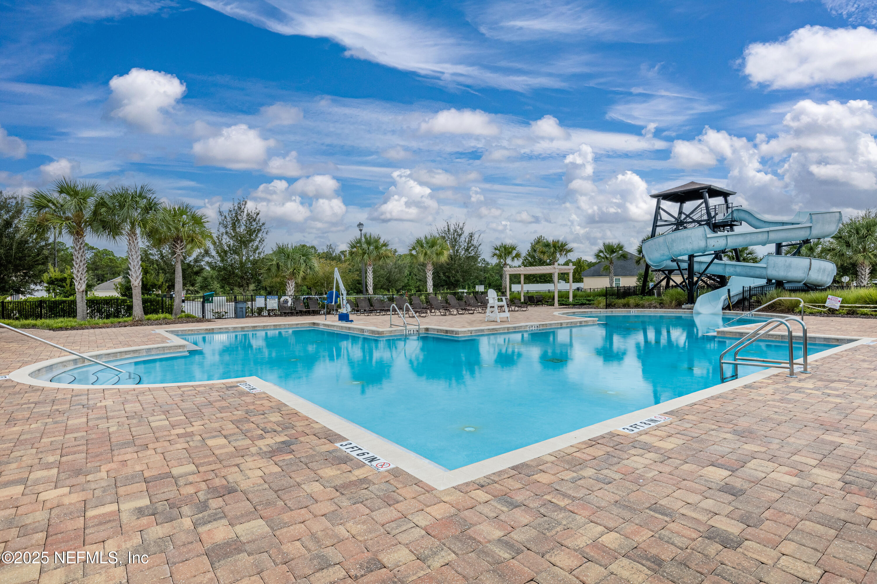 4100 Spring Creek Lane Middleburg, FL 32068 - Photo 58 of 58 a view of a swimming pool with an outdoor seating