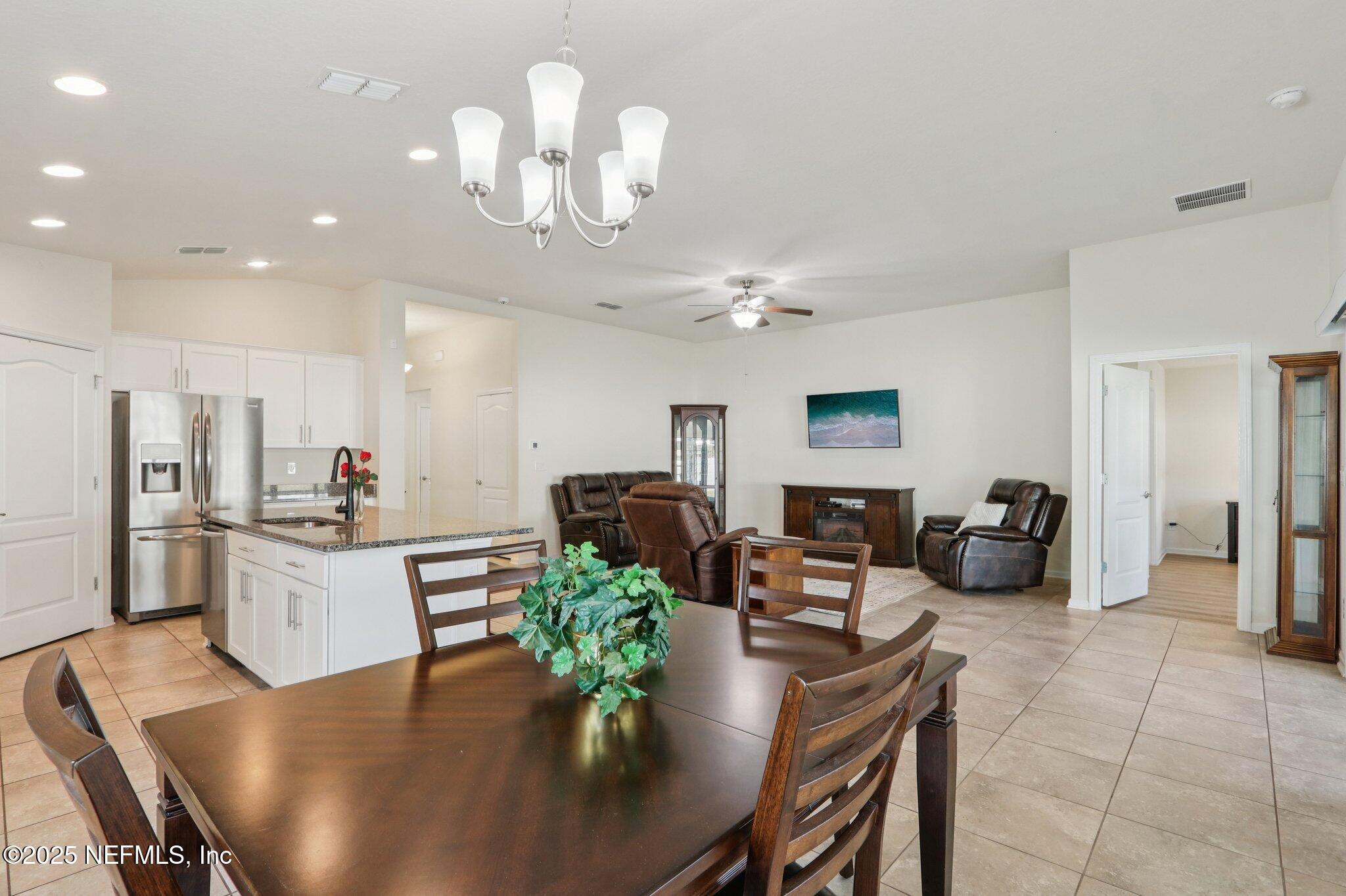 4100 Spring Creek Lane Middleburg, FL 32068 - Photo 10 of 58 a view of a dining room with furniture