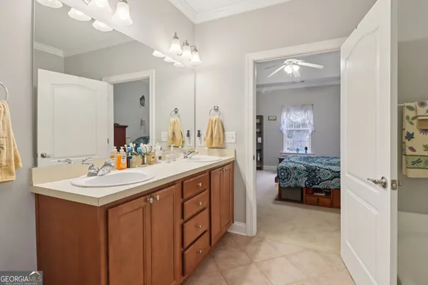 a bathroom with a sink vanity and a mirror