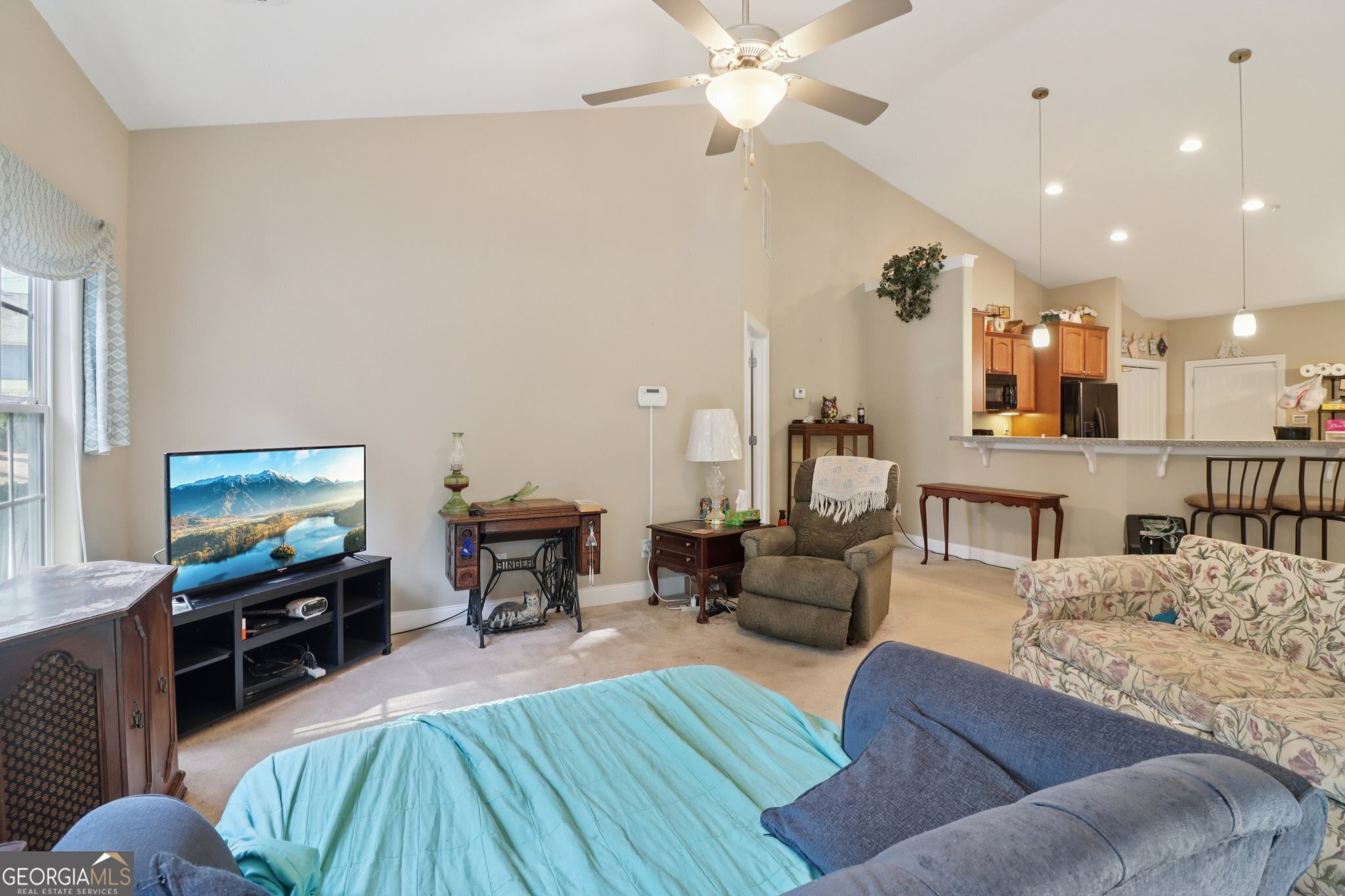 1502 Commonwealth Circle Newnan, GA 30263 - Photo 9 of 33 a living room with furniture and a flat screen tv