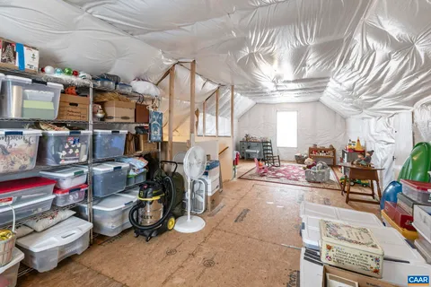 a bedroom with furniture and a chandelier