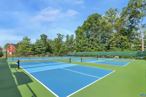 a view of a chairs and table in backyard
