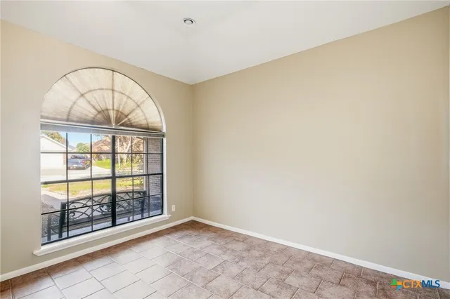 an empty room with windows