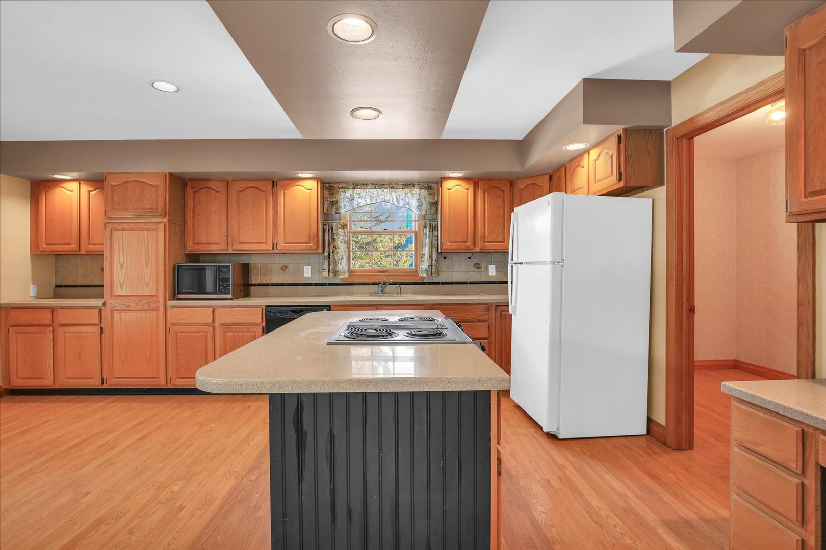 2002 O O Donnell Drive Champaign, IL 61821 - Photo 18 of 45 a kitchen with stainless steel appliances granite countertop a refrigerator a sink and a stove