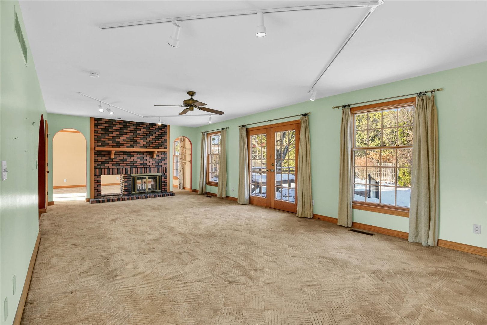 2002 O O Donnell Drive Champaign, IL 61821 - Photo 10 of 45 a view of an empty room with a fireplace and a window