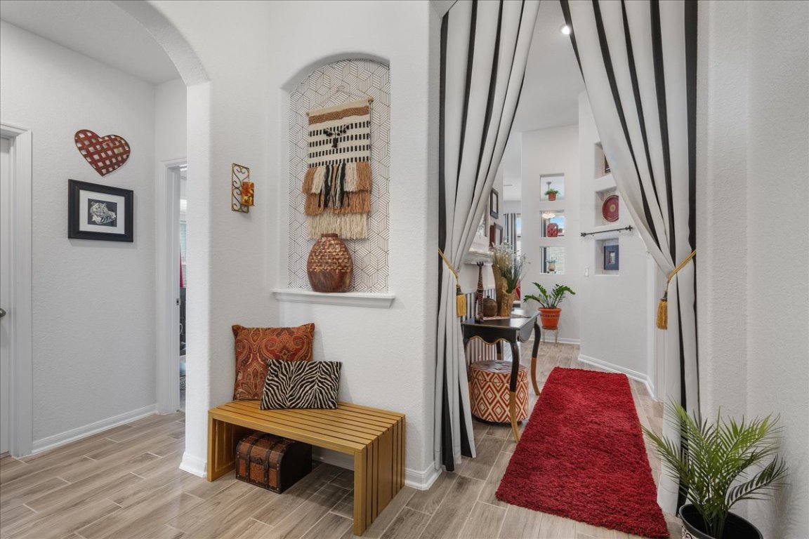 181 Durian Loop Buda, TX 78610 - Photo 3 of 22 a living room with furniture and a mirror