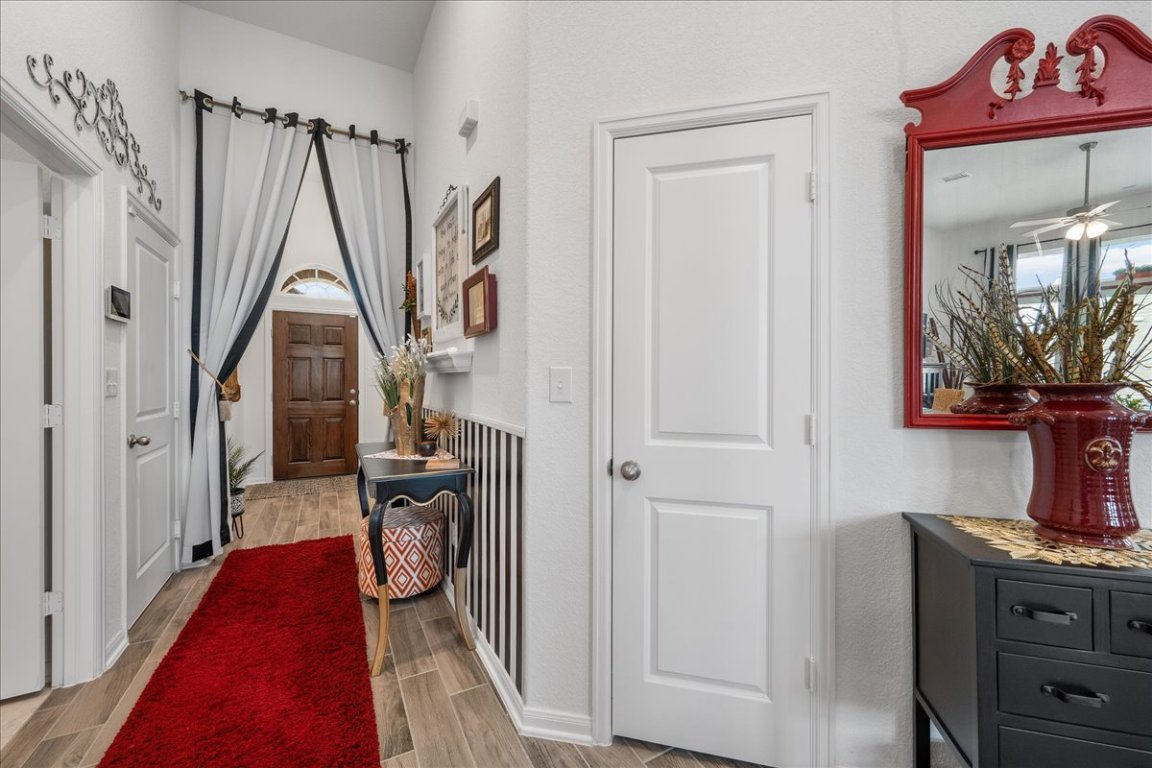 181 Durian Loop Buda, TX 78610 - Photo 4 of 22 a hallway with a washer and dryer