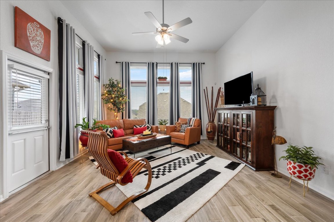 181 Durian Loop Buda, TX 78610 - Photo 10 of 22 a living room with furniture and a flat screen tv