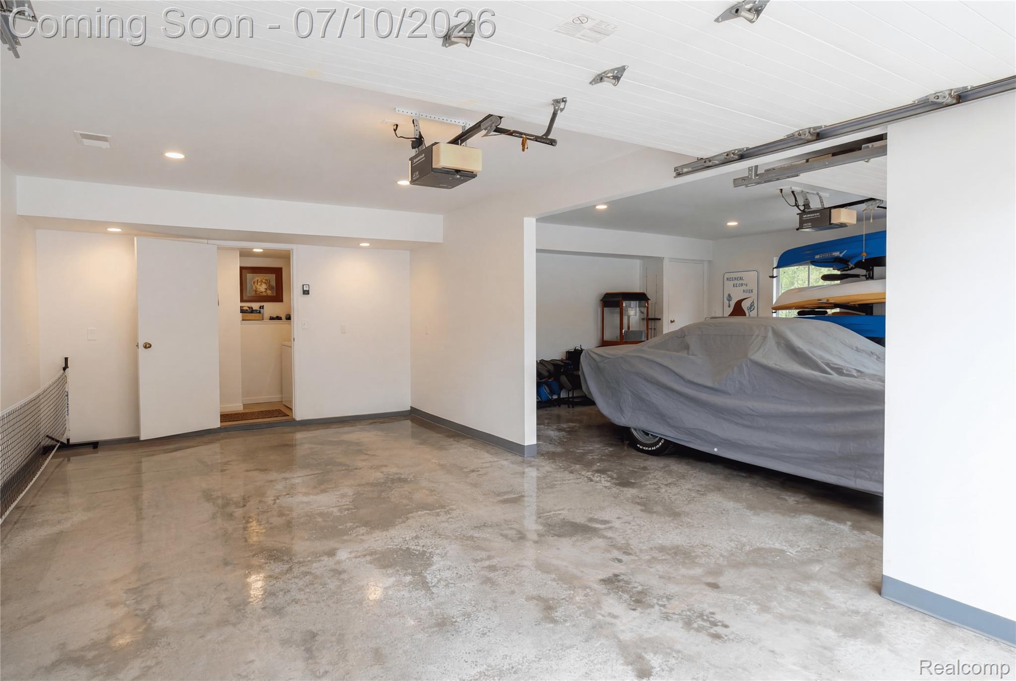 5278 Skelton Road Columbiaville, MI 48421 - Photo 62 of 64 Spacious garage featuring polished concrete flooring and white paneled ceilings