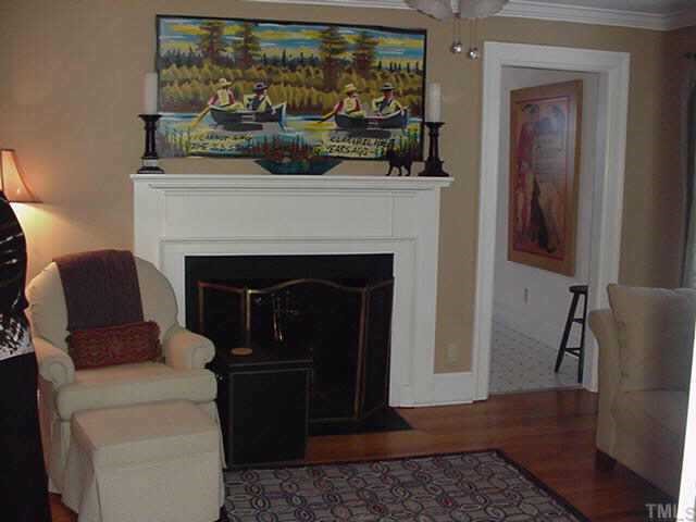 1206 Watauga Street Raleigh, NC 27604 - Photo 3 of 10 a living room with furniture and a fireplace