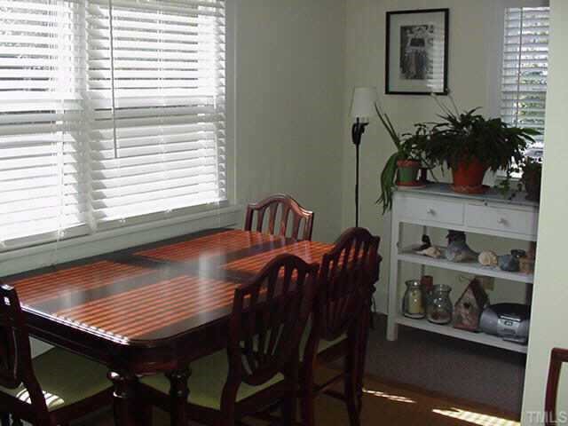 1206 Watauga Street Raleigh, NC 27604 - Photo 4 of 10 a dining room with furniture and wooden floor