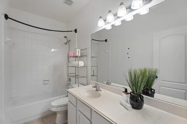 a bathroom with a sink a toilet and a bathtub