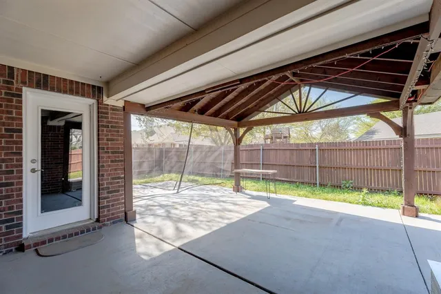a view of a backyard of the house