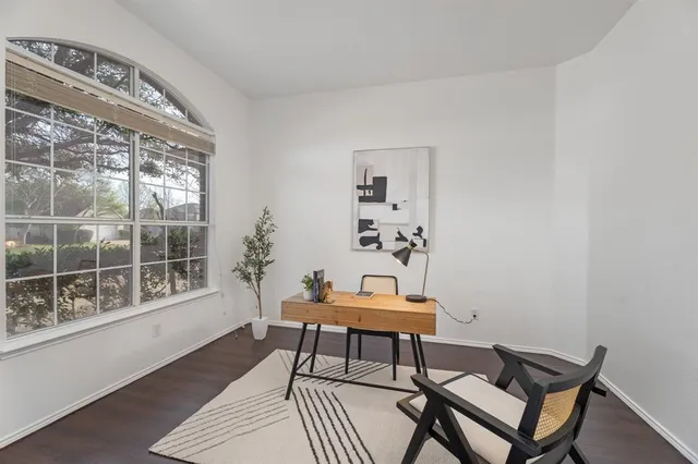 a room with furniture and wooden floor
