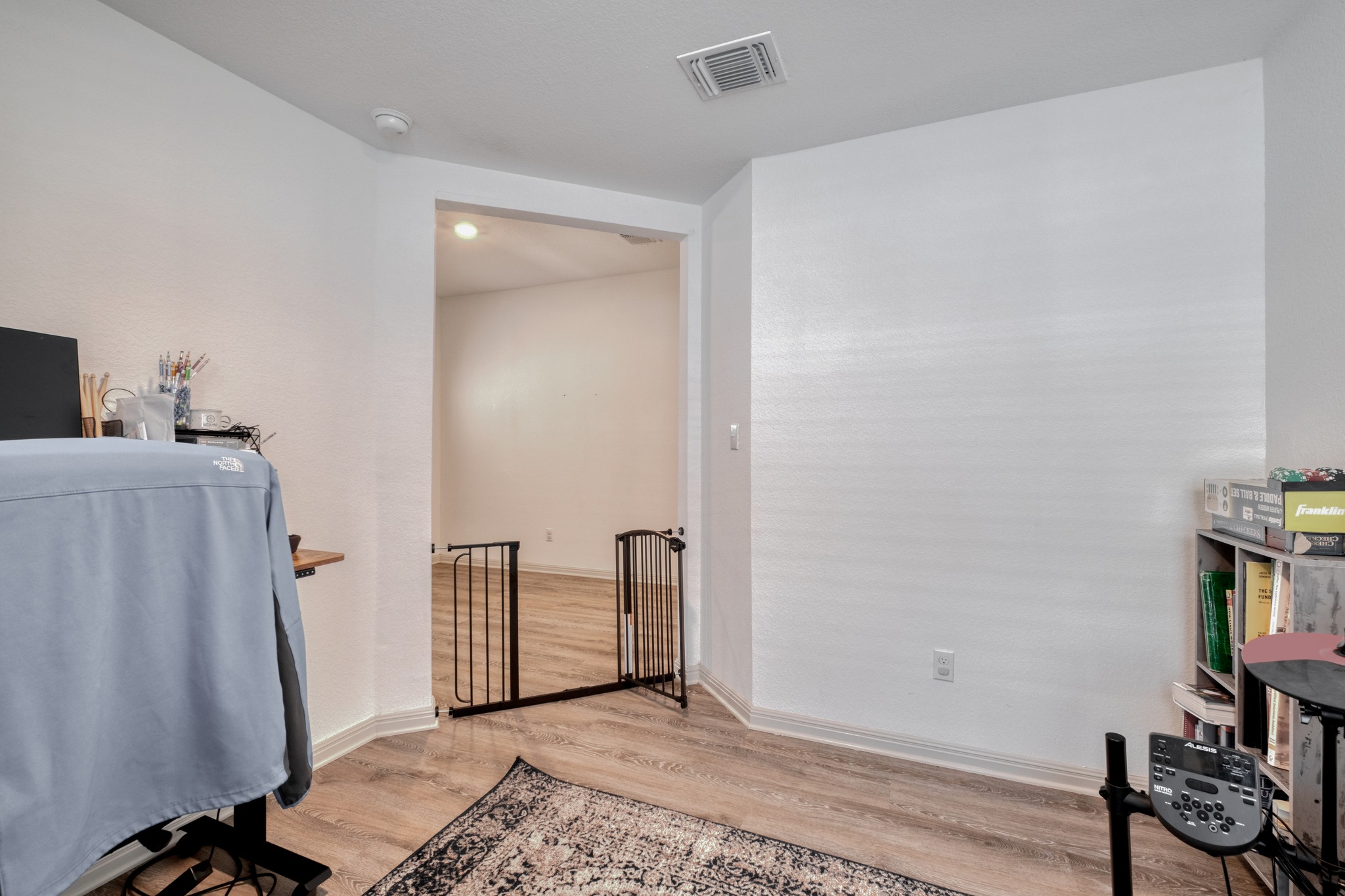 102 Johnson Draw Road Hutto, TX 78634 - Photo 14 of 30 Gleaming wood-look floors anchor this versatile room boasting crisp walls and recessed lighting.