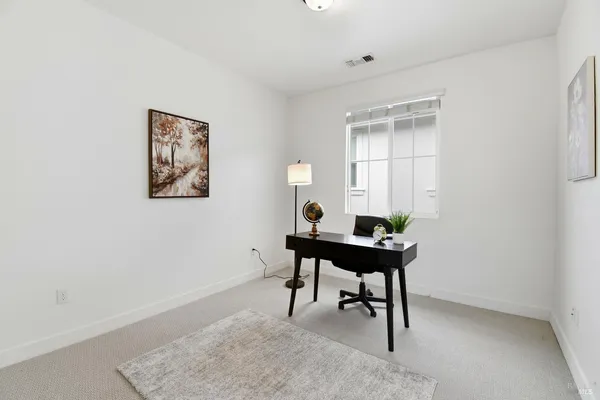 a view of a workspace with furniture