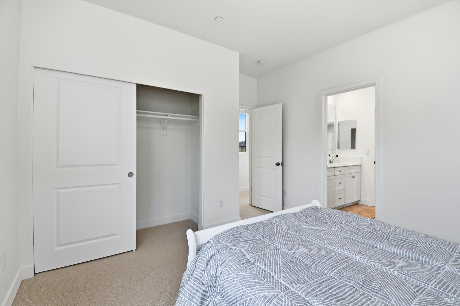 1612 Rose Clover Street Santa Rosa, CA 95403 - Photo 23 of 40 a bedroom with a bed and a mirror