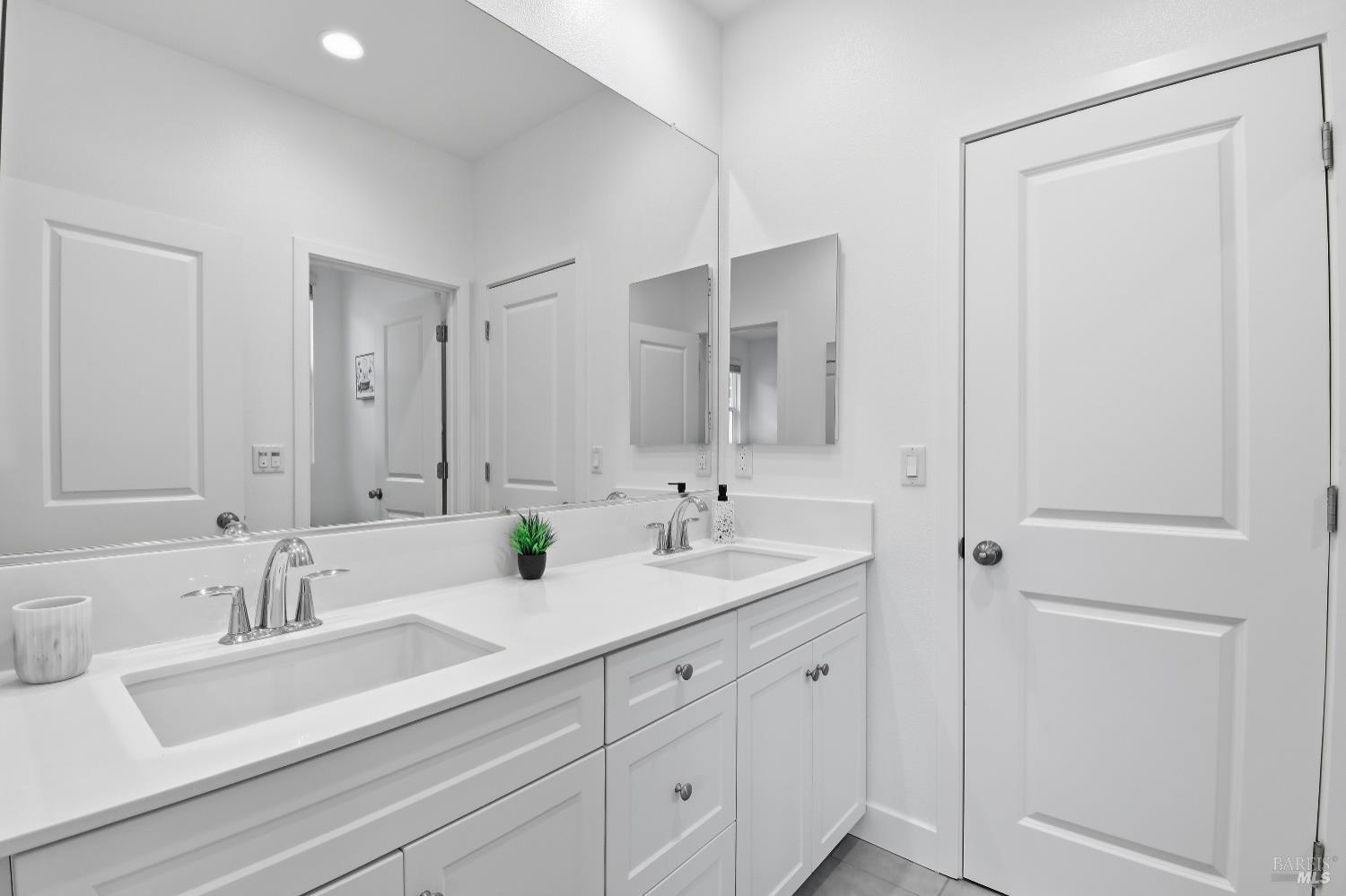 1612 Rose Clover Street Santa Rosa, CA 95403 - Photo 28 of 40 a bathroom with double sink and a mirror