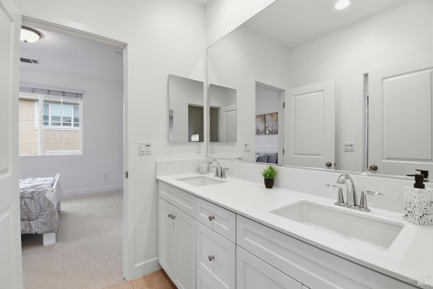 1612 Rose Clover Street Santa Rosa, CA 95403 - Photo 29 of 40 a bathroom with 2 sink tub and a mirror