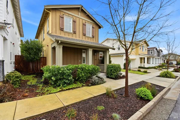 a front view of a residential houses with yard
