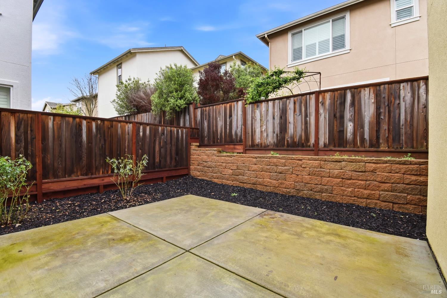 1612 Rose Clover Street Santa Rosa, CA 95403 - Photo 36 of 40 a view of a backyard with a chair and table in the patio