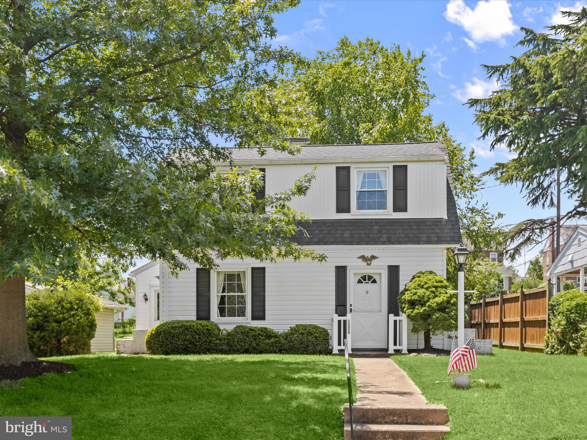 1229-7 Seven Oaks Road Halethorpe, MD 21227 - Photo 29 of 38 a front view of house with yard and green space