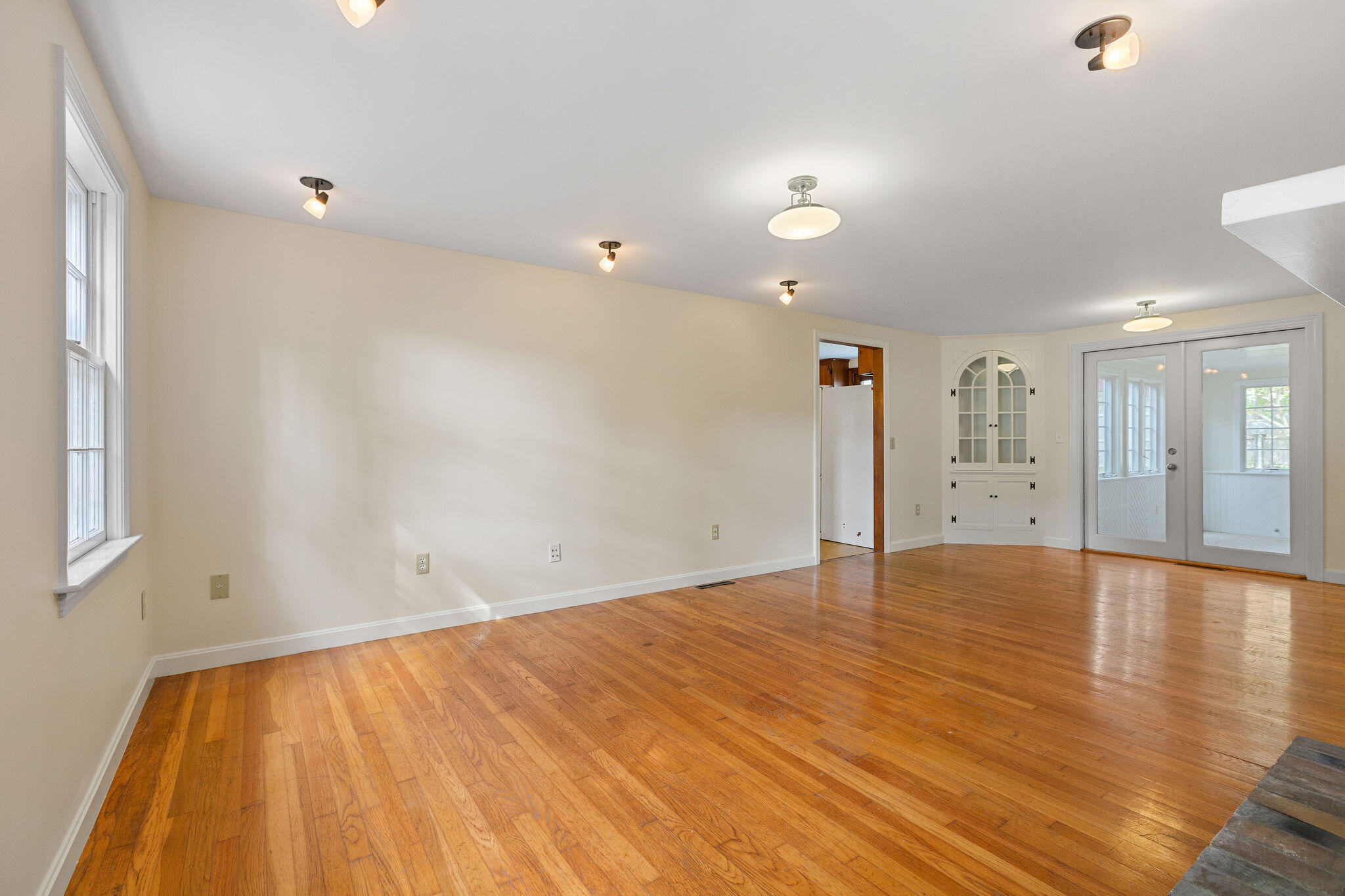 44 Beriah Brooks Road Harwich, MA 02645 - Photo 14 of 43 a view of an empty room with wooden floor and a window