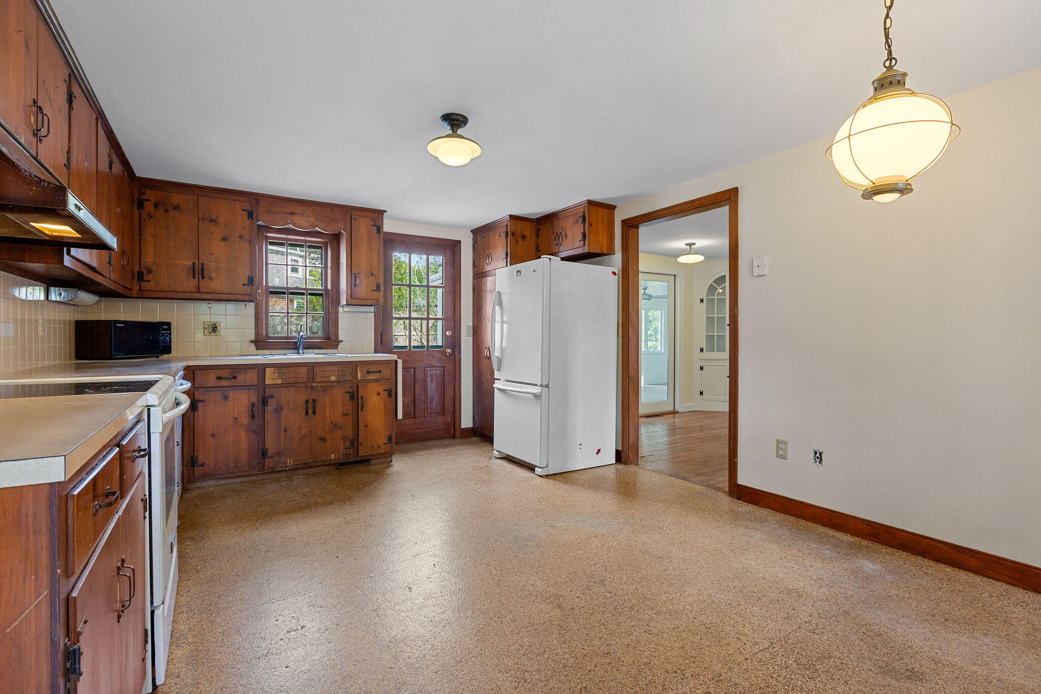 44 Beriah Brooks Road Harwich, MA 02645 - Photo 19 of 43 a view of a kitchen with furniture and a ceiling fan