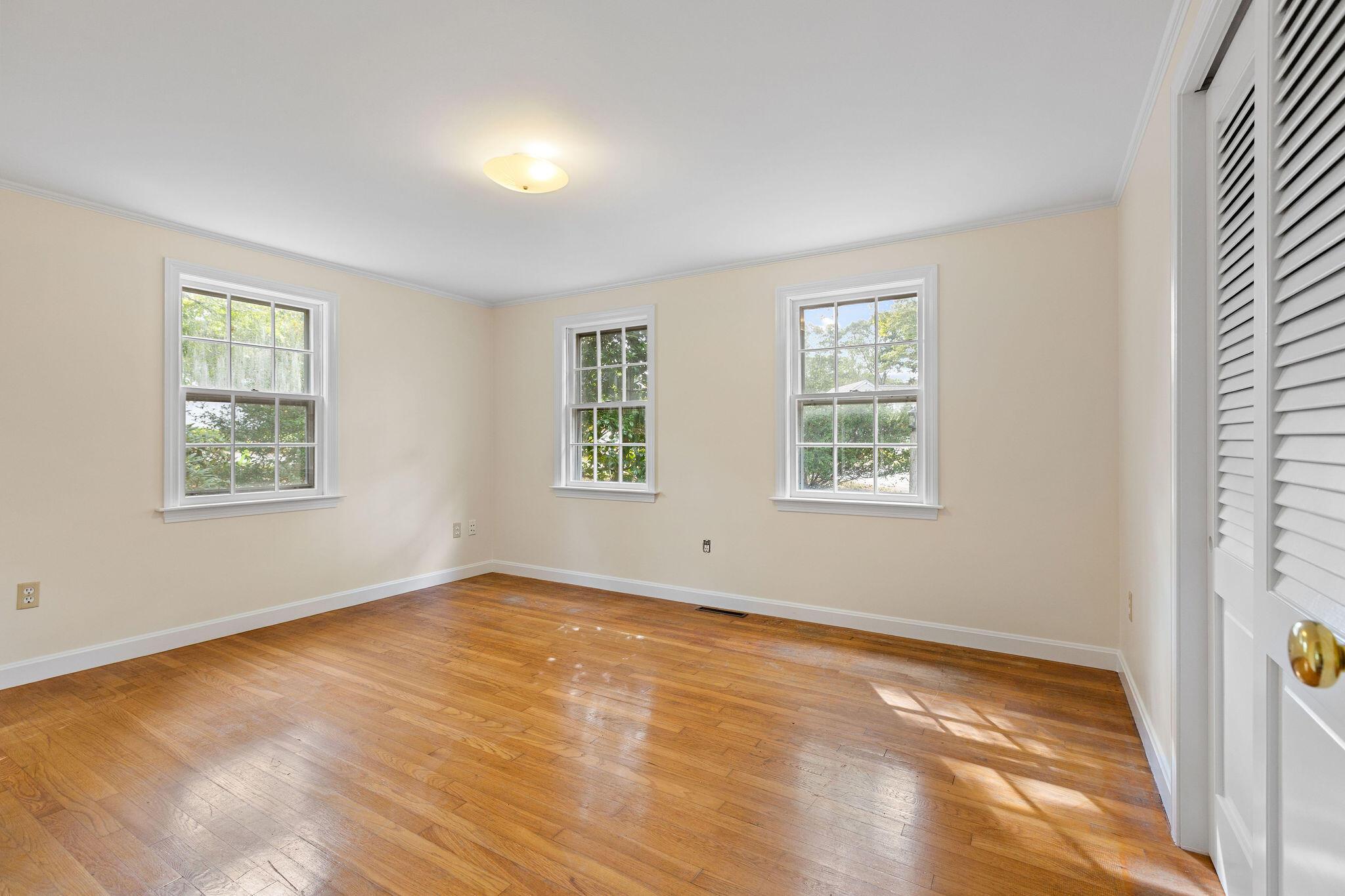 44 Beriah Brooks Road Harwich, MA 02645 - Photo 27 of 43 a view of an empty room with wooden floor and a window