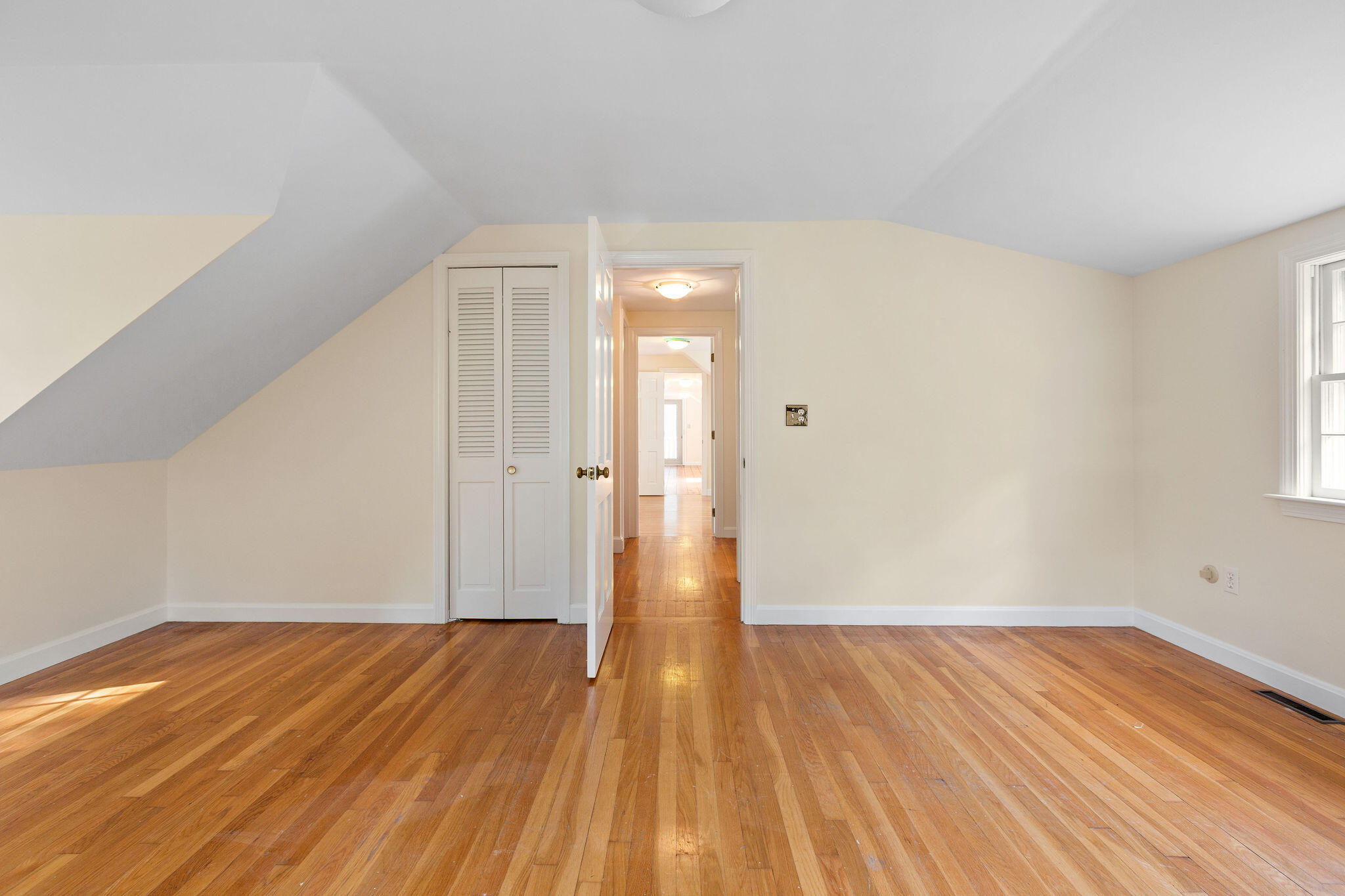 44 Beriah Brooks Road Harwich, MA 02645 - Photo 32 of 43 a view of a room with wooden floor and white walls