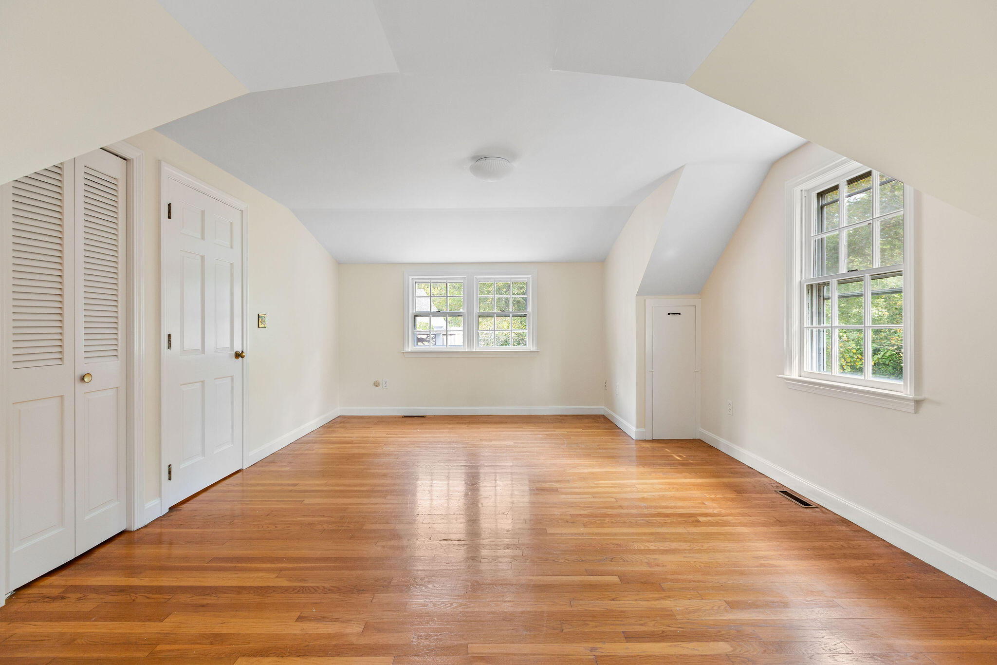 44 Beriah Brooks Road Harwich, MA 02645 - Photo 33 of 43 a view of an empty room with wooden floor and a window