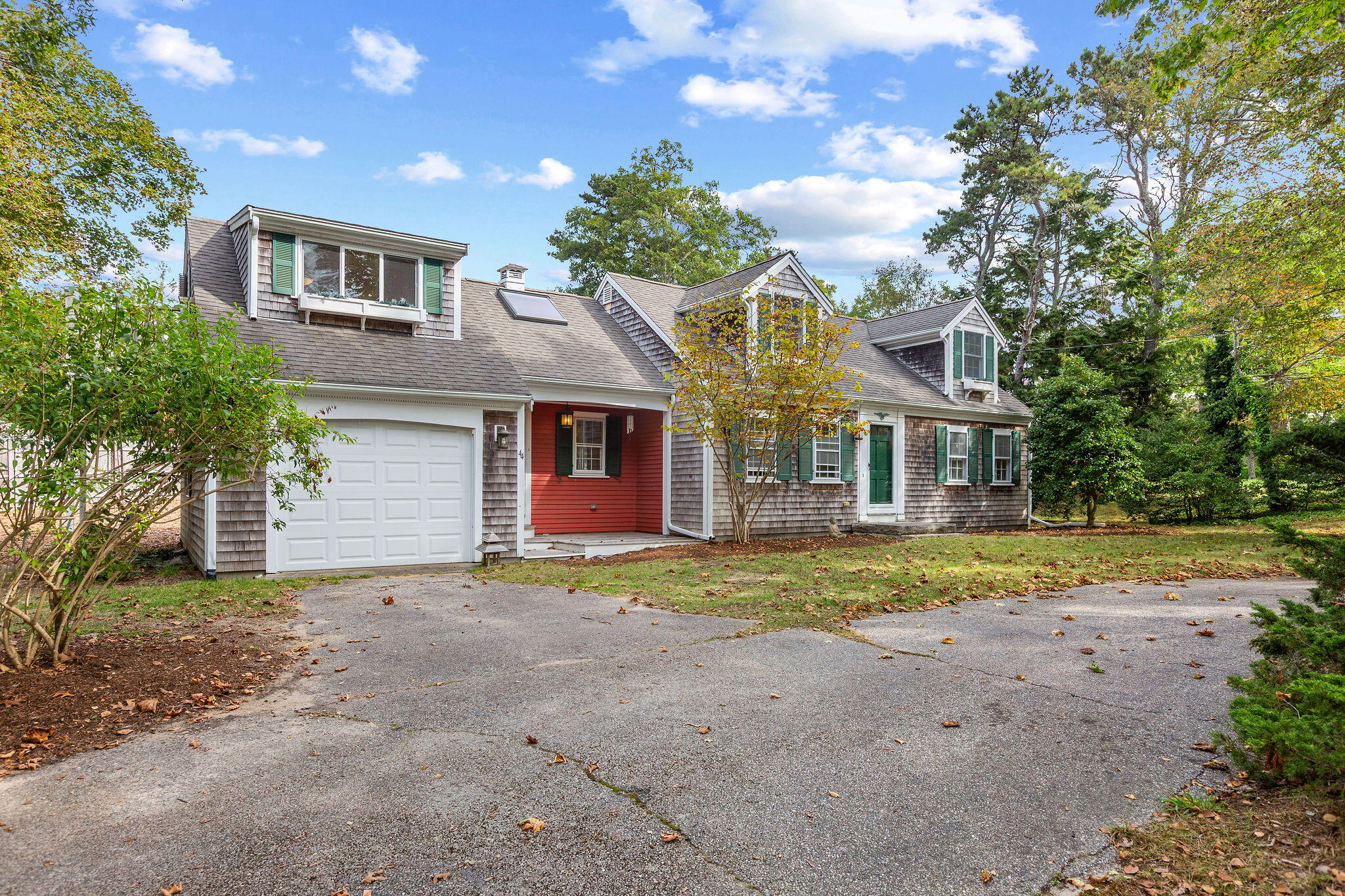 44 Beriah Brooks Road Harwich, MA 02645 - Photo 4 of 43 a front view of a house with a yard and garage