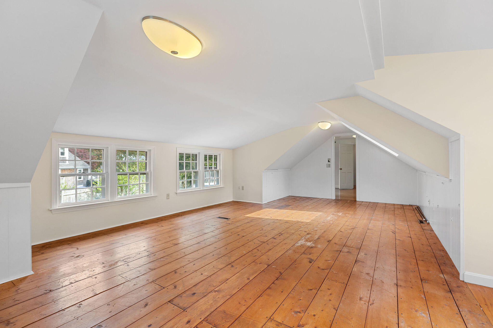 44 Beriah Brooks Road Harwich, MA 02645 - Photo 41 of 43 an empty room with wooden floor and windows