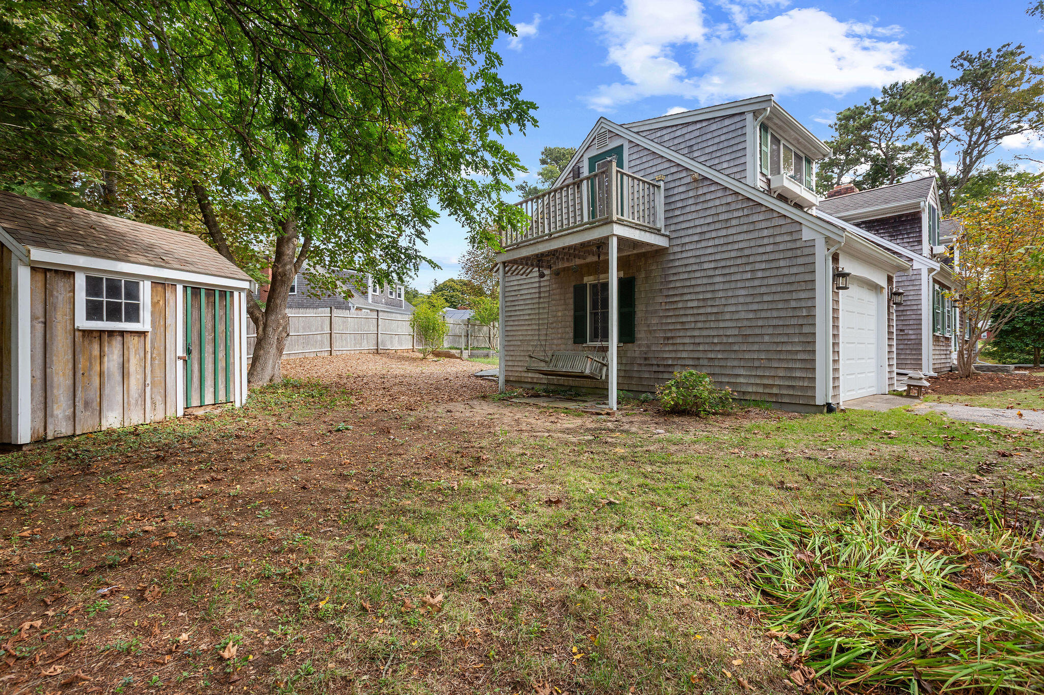 44 Beriah Brooks Road Harwich, MA 02645 - Photo 8 of 43 a backyard of a house with plants and large tree