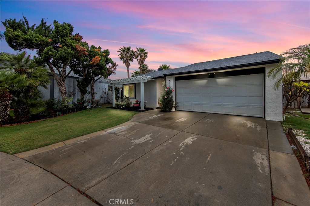 10105 Tanforan Drive Riverside, CA 92503 - Photo 1 of 1 a front view of a house with a yard and garage