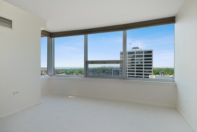 807 Davis Street, Unit 1504 Evanston, IL 60201 - Photo 8 of 14 a view of empty room with balcony and floor to ceiling window