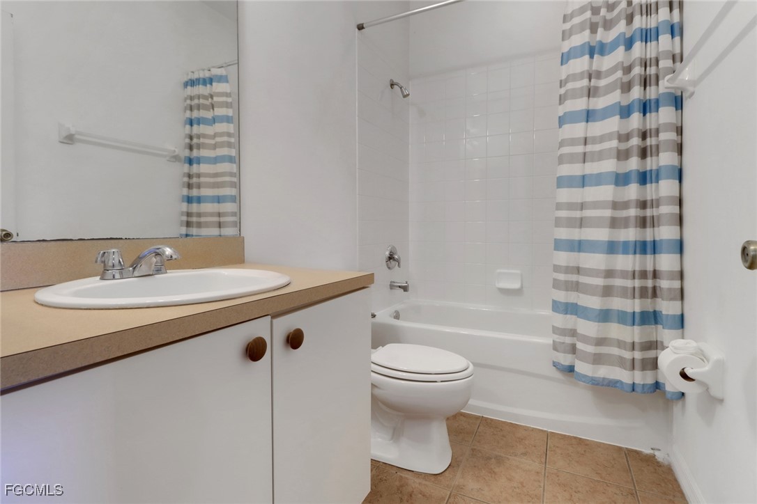 4214 Bellasol Circle, Unit 824 Fort Myers, FL 33916 - Photo 16 of 27 a bathroom with a sink toilet and shower