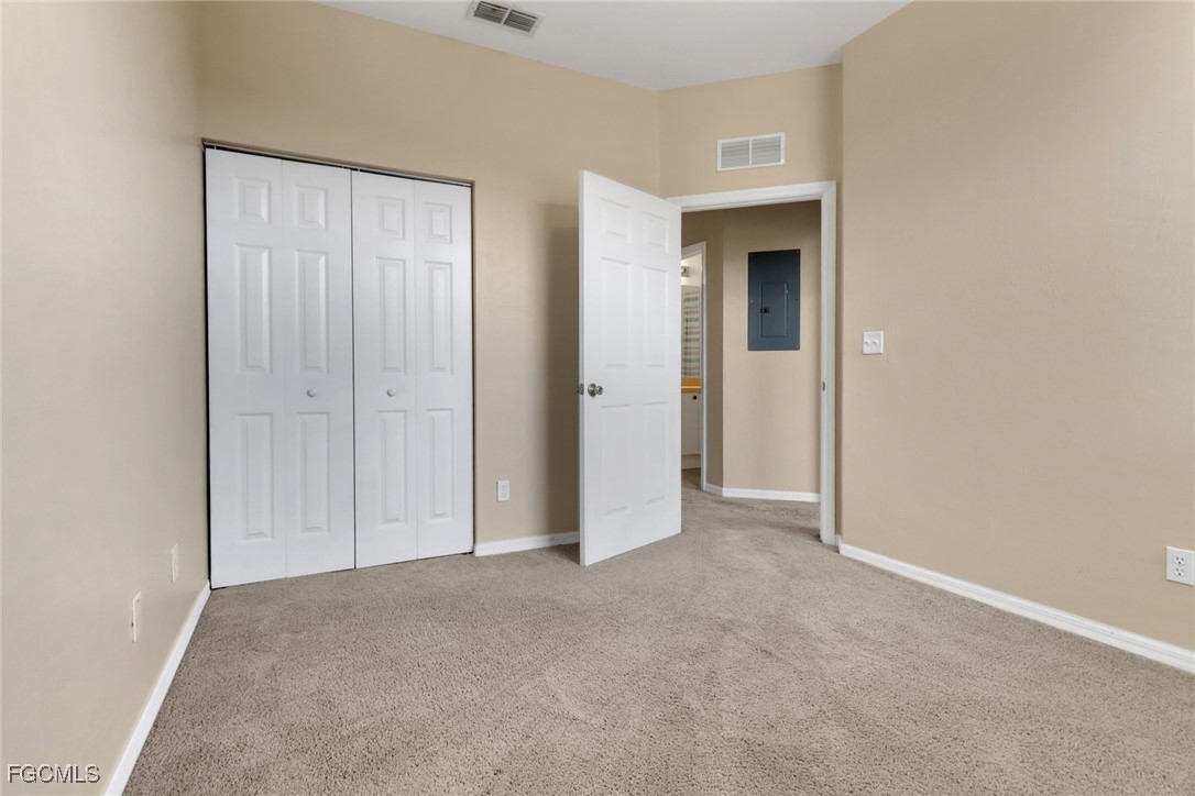 4214 Bellasol Circle, Unit 824 Fort Myers, FL 33916 - Photo 17 of 27 a view of an empty room with closet and entryway