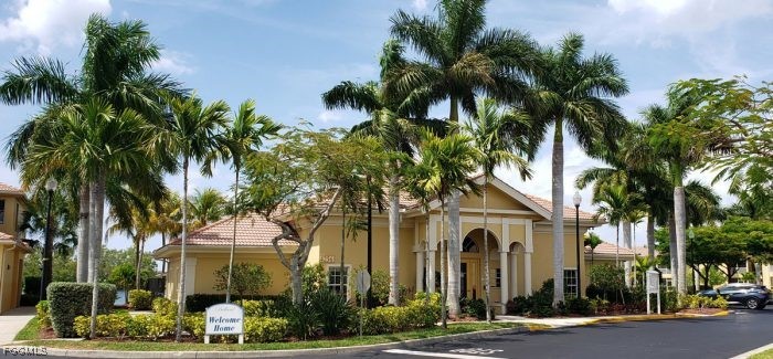 4214 Bellasol Circle, Unit 824 Fort Myers, FL 33916 - Photo 23 of 27 a front view of a house with a tree