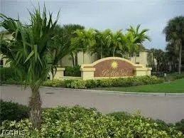 a front view of a house with a yard and a garage