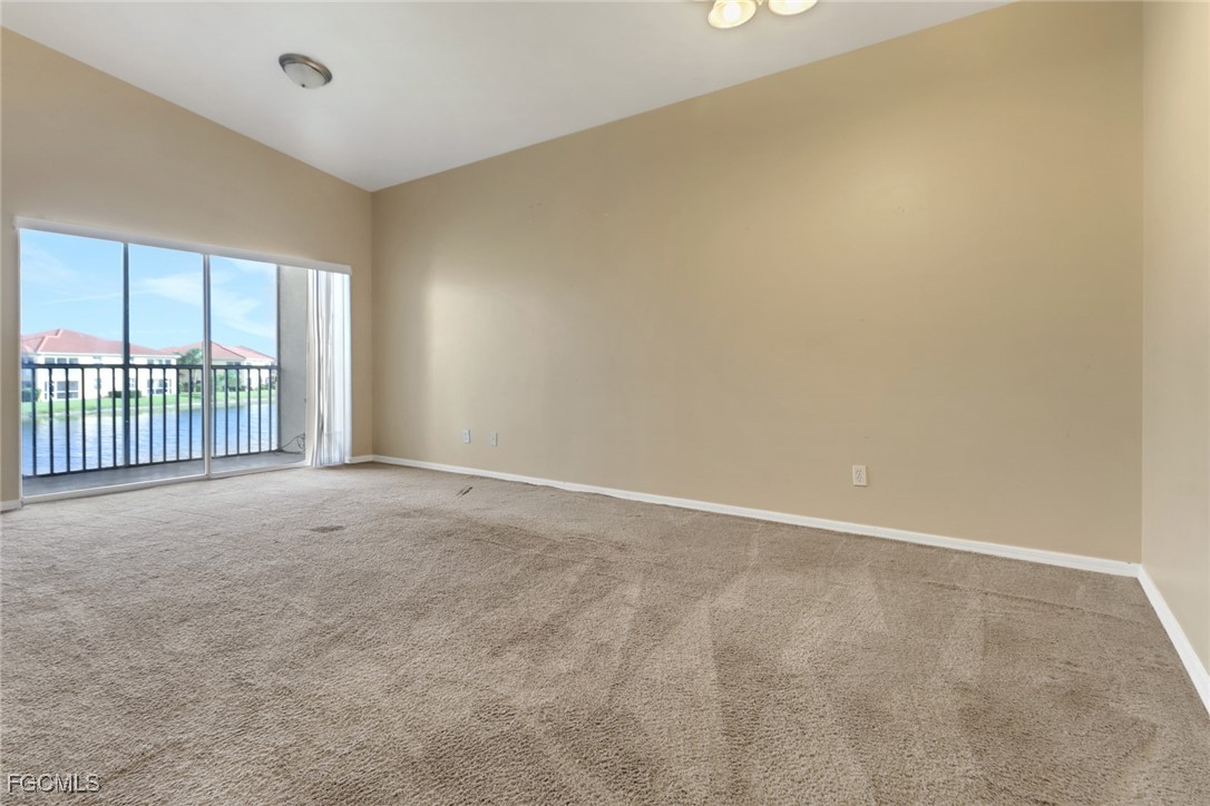 4214 Bellasol Circle, Unit 824 Fort Myers, FL 33916 - Photo 7 of 27 a view of an empty room with a window