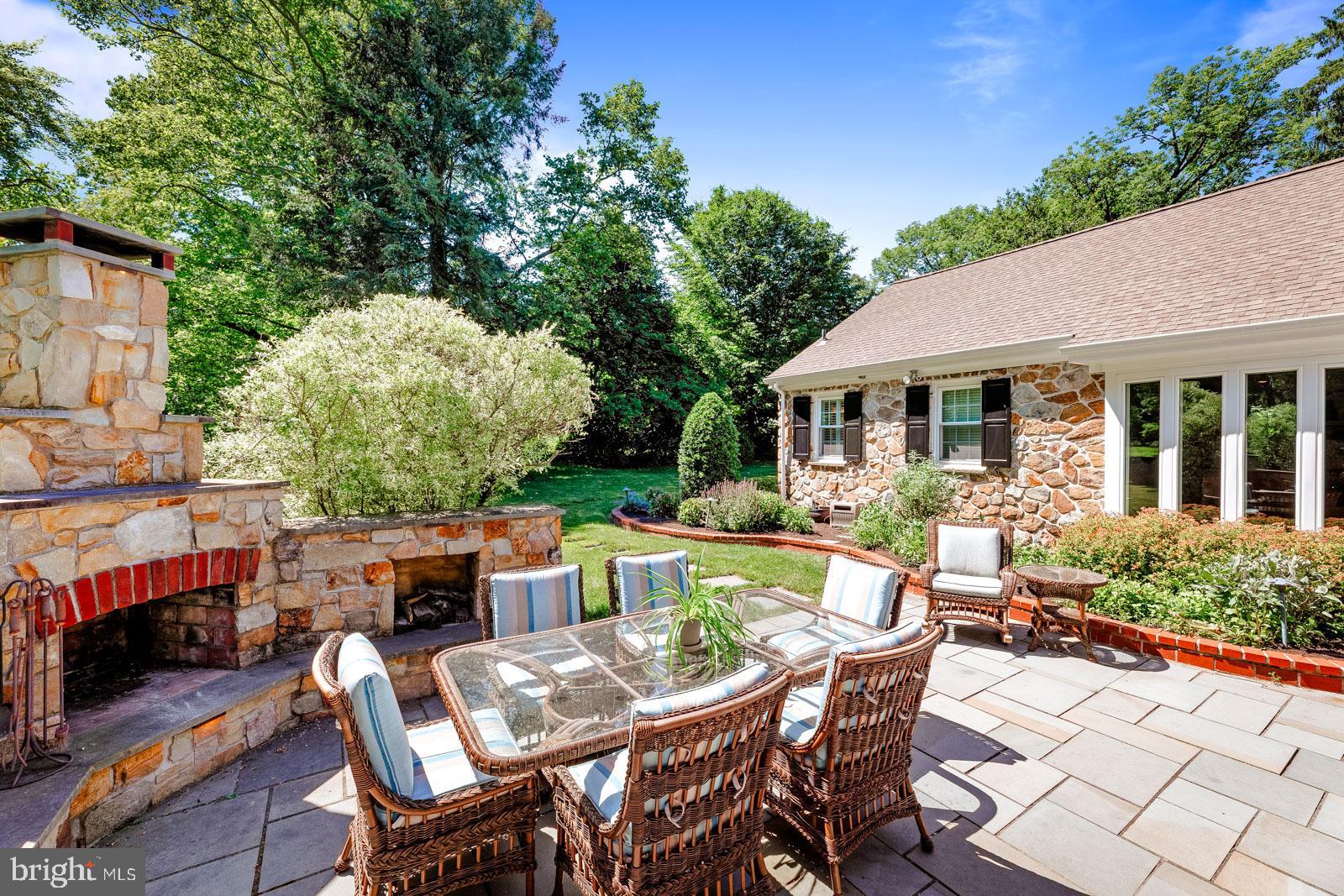 1700 Old Welsh Road Huntingdon Valley, PA 19006 - Photo 74 of 105 a view of a patio with table and chairs potted plants and a large tree