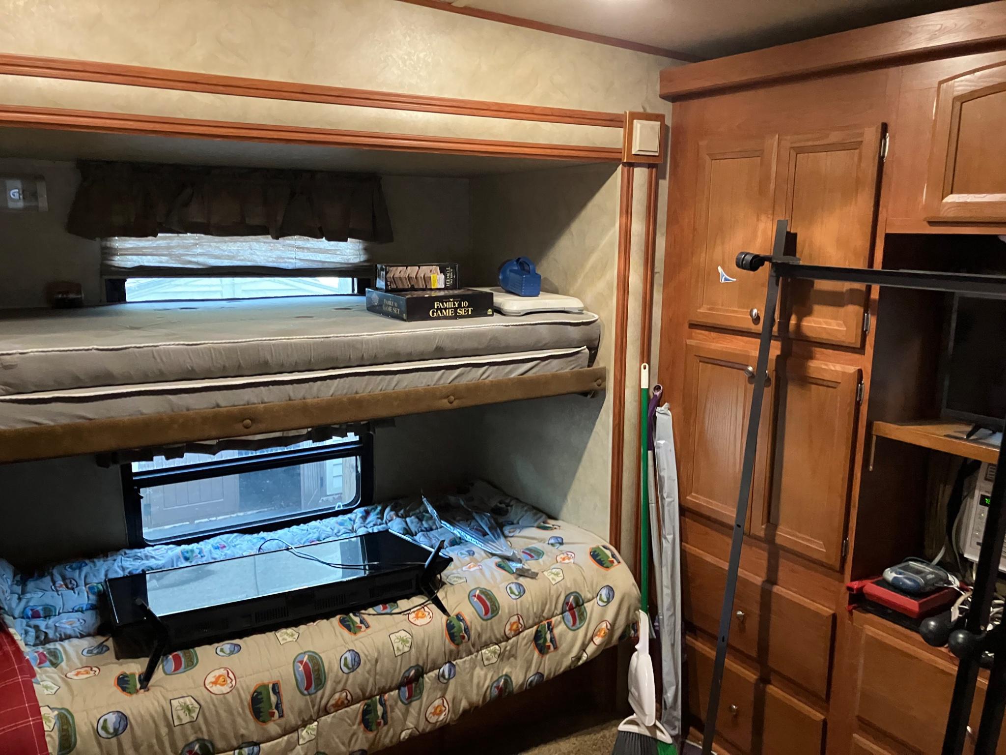 8 Poison Oak Falling Waters, WV 25419 - Photo 11 of 13 a bedroom with a bed and a television