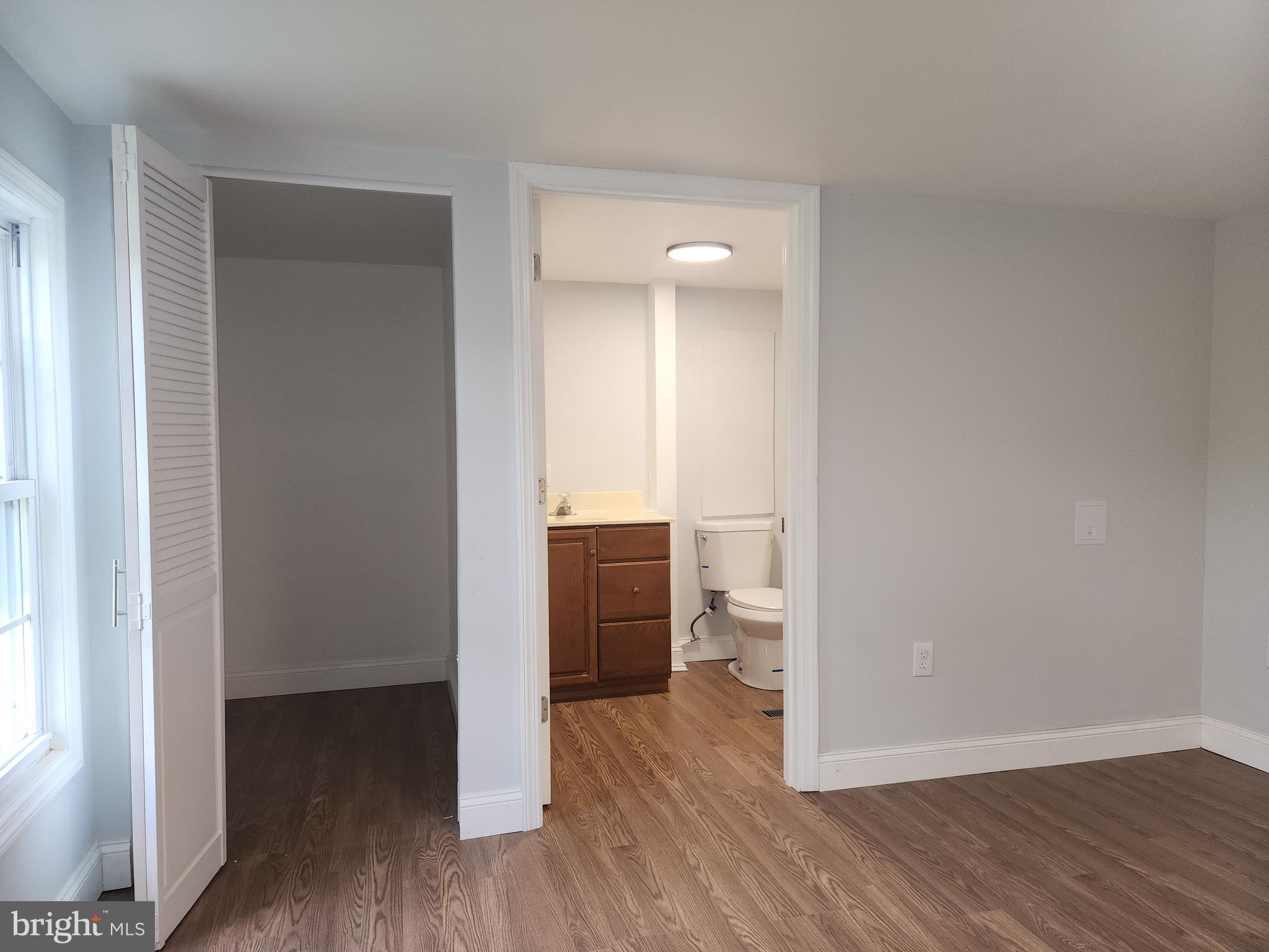 41 Mountain View Terrace Newville, PA 17241 - Photo 30 of 34 a view of a room with wooden floor a ceiling fan and a bathroom
