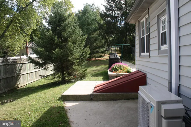 a patio with water view fountain and a lake view