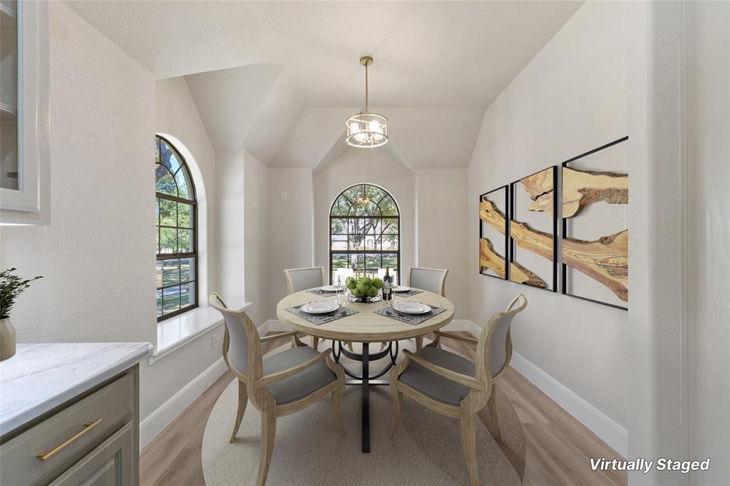 615 West Aurora Vista Trail Aurora, TX 76078 - Photo 10 of 40 a view of a dining room with furniture window and wooden floor
