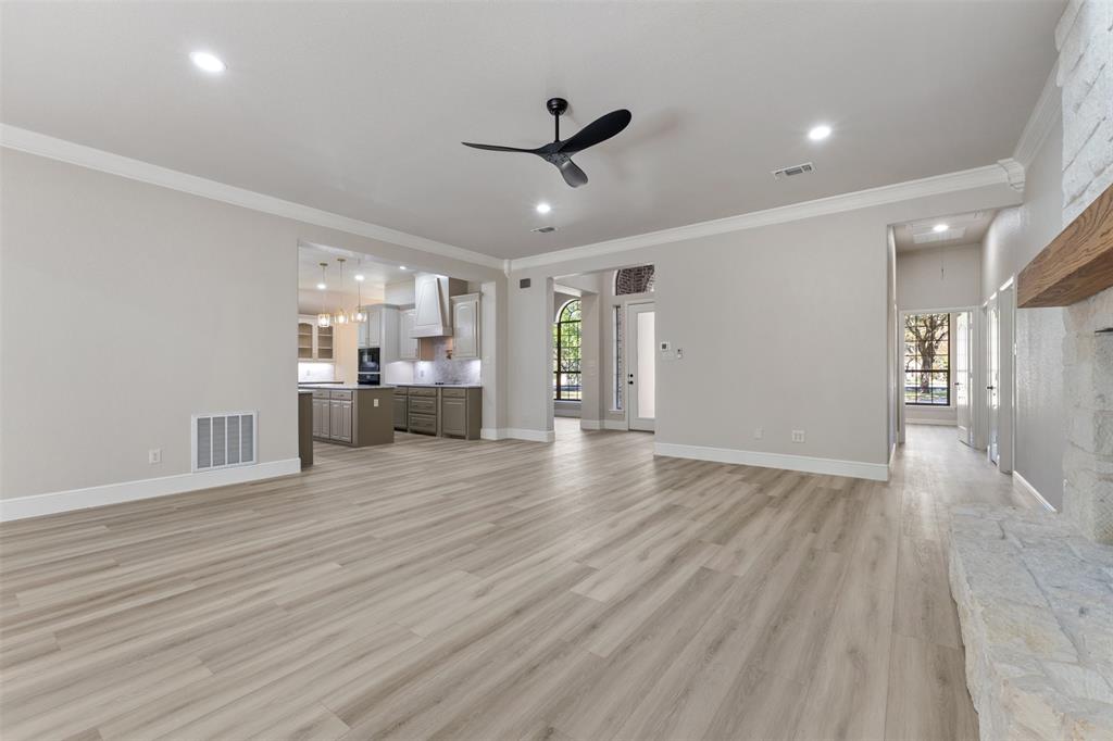 615 West Aurora Vista Trail Aurora, TX 76078 - Photo 11 of 40 a view of a kitchen with a sink and cabinet area with wooden floor