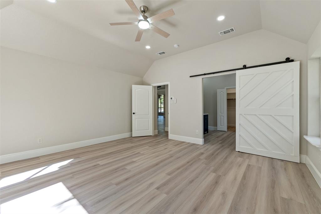 615 West Aurora Vista Trail Aurora, TX 76078 - Photo 18 of 40 wooden floor in an empty room with a window