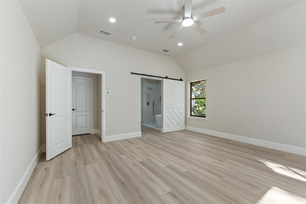 615 West Aurora Vista Trail Aurora, TX 76078 - Photo 19 of 40 wooden floor in an empty room with a window